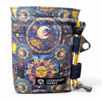 Legendary Wares celestial sun and moon stained glass dice bag with drawstring closure. Vibrant blues, yellows, and purples.