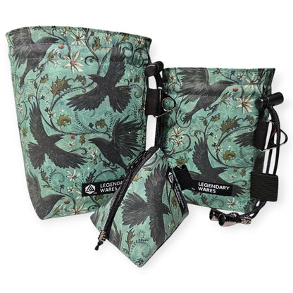 Legendary Wares Ravenflight dice bag set with flying raven pattern on teal background. Includes large and small bags and a dice pouch.