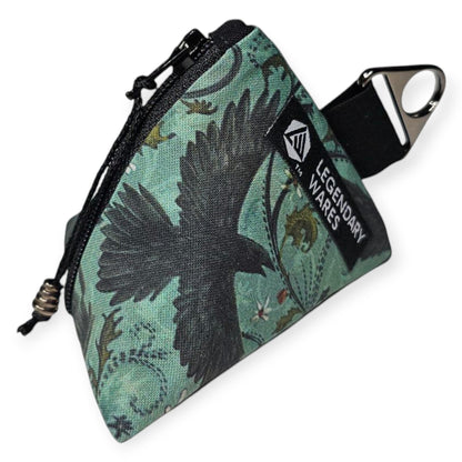 Legendary Wares Ravenflight dice bag with a black raven design on a teal background, featuring a drawstring closure.
